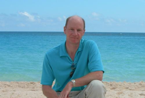 Picture of Michael Depledge on a beach with the sea in the background